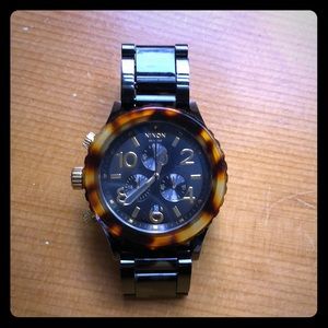 NIXON Tortoise Shell, Black and Gold Watch.